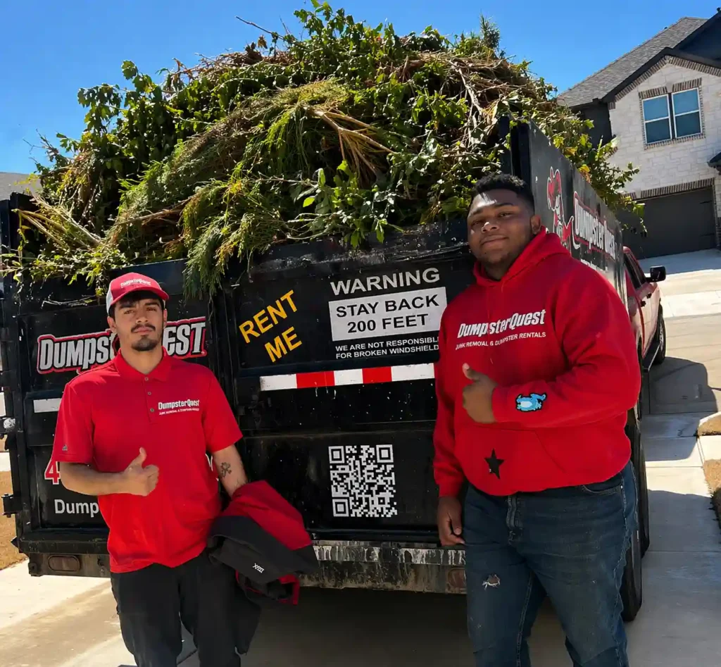 yard waste dumpster filled with branches and landscaping debris