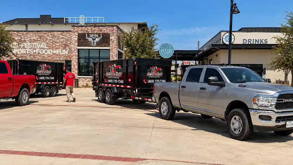 rubber-tired dump trailer on a residential driveway, avoiding a city dumpster permit fee