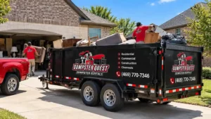 Dumpster Quest rubber-tired dump trailer on a North Dallas driveway loaded with furniture and household items from a house cleanout